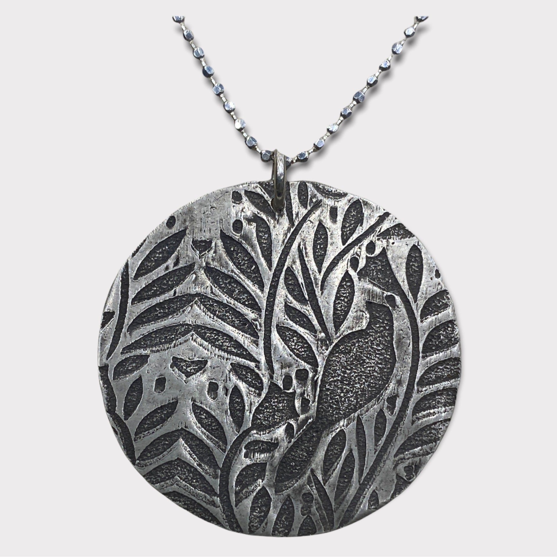 Roots with wings large bird pendant